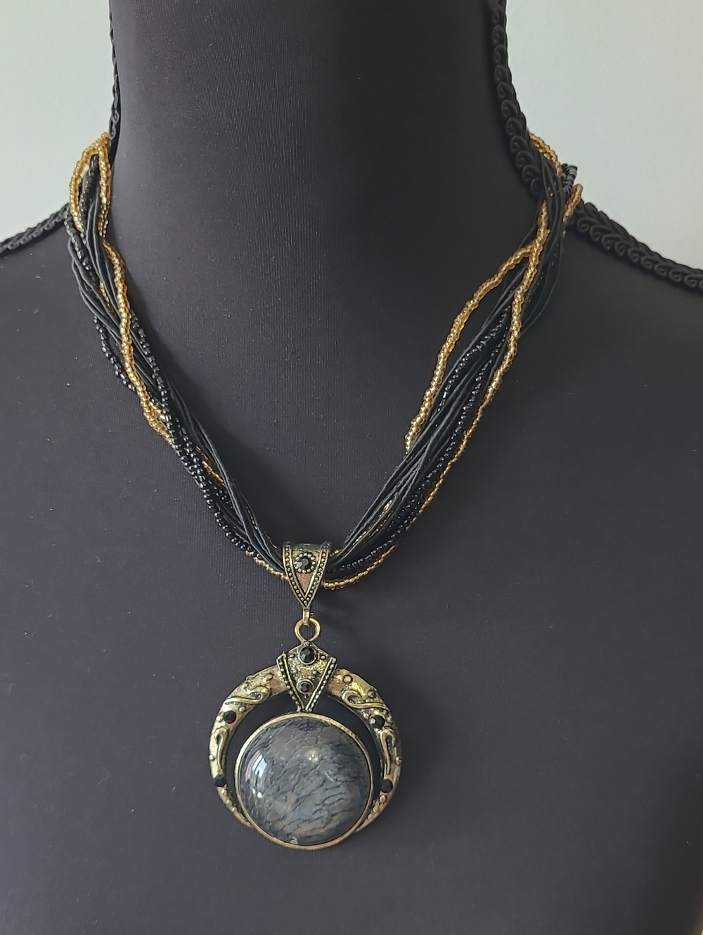 229 - Antique-Look Black and Gold Multi-Strand Pendant Necklace with Dark Stone